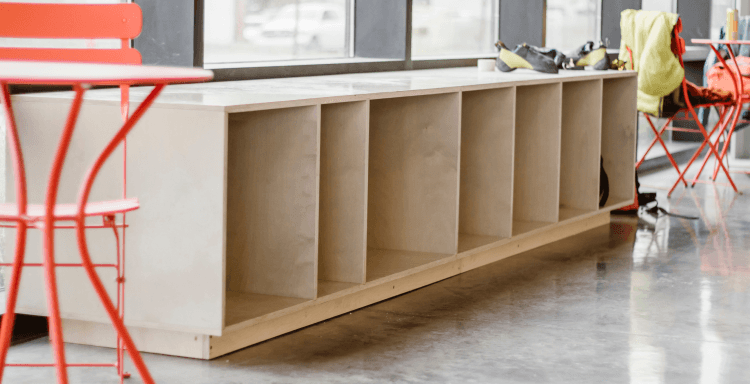 Modular white birch storage cubby sitting next to a bright window