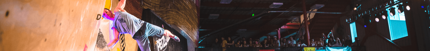 A man bouldering in front of a crowd at the Di'Namik competition at The Front Climbing Club