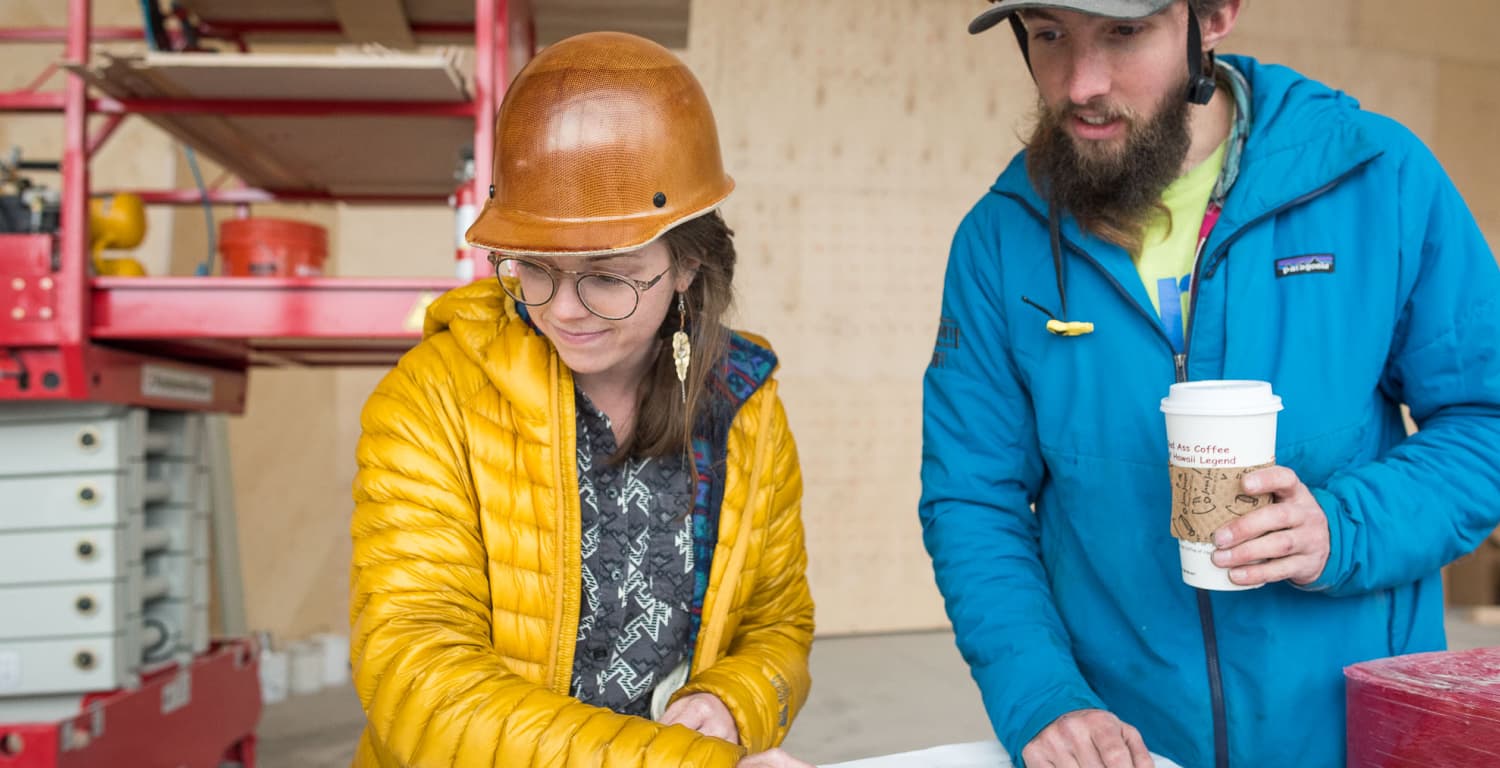 Climbing wall designers review blueprints