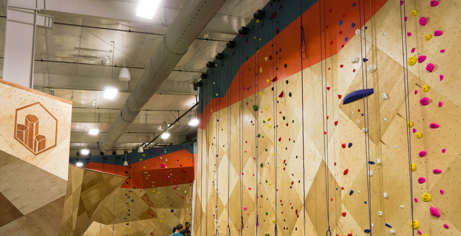 Indoor climbing gym walls with hardwood inlay