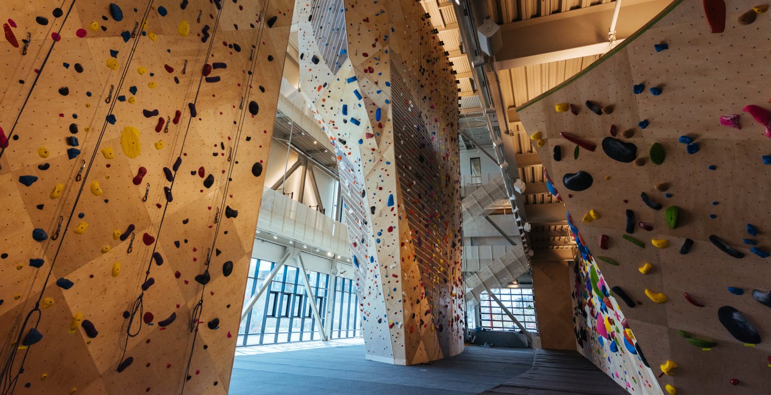 Indoor climbing wall tower and bouldering wall during daytime