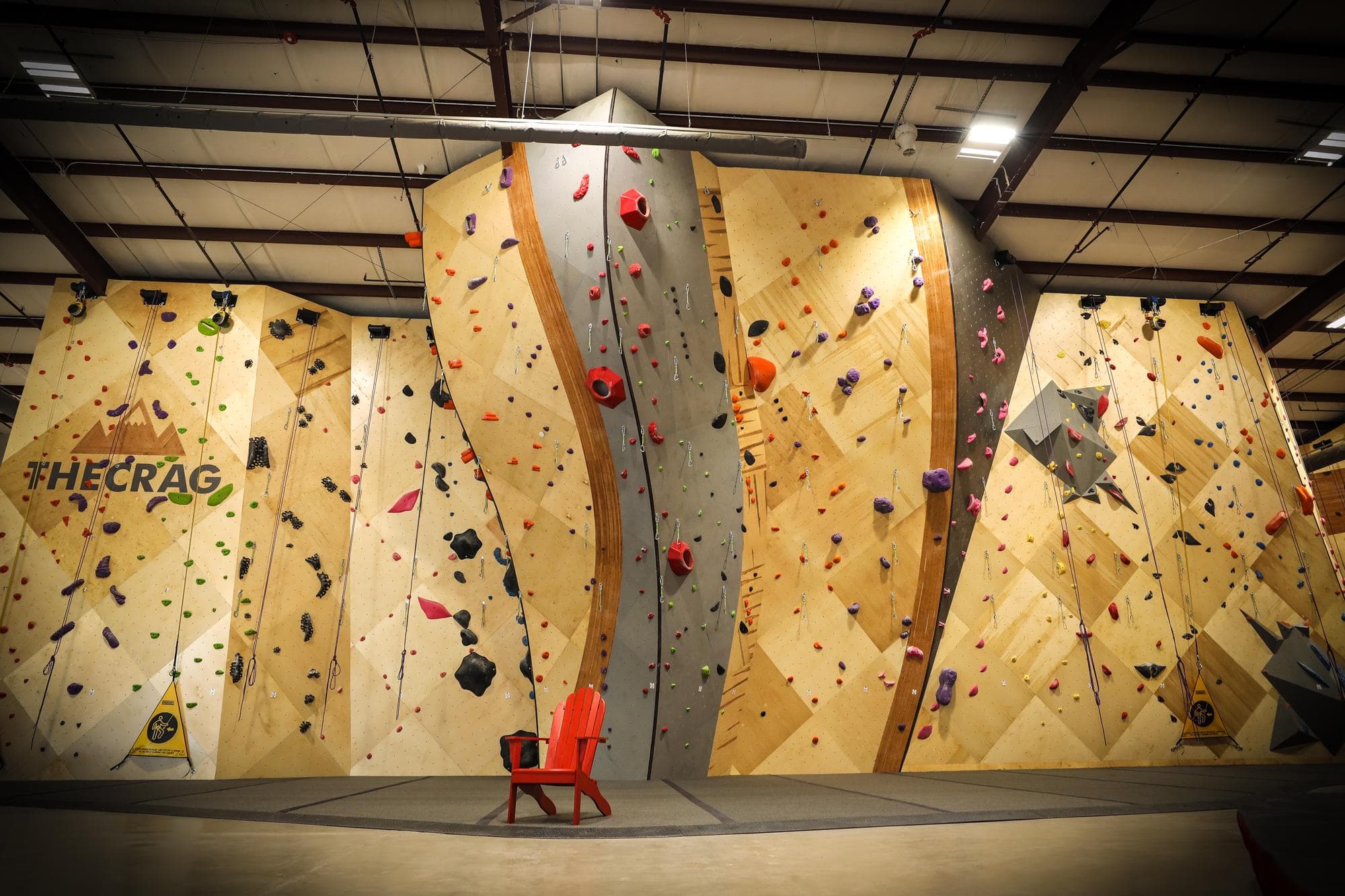 Commercial bouldering wall with colorful climbing holds