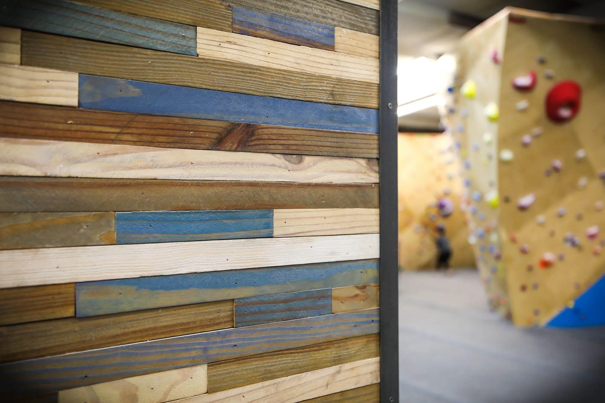 An unmistakeable branding feature of this facility: The detail wood decor on the locker rooms and party rooms, tying the whole facility together for a consistent look and feel with the climbing walls.
