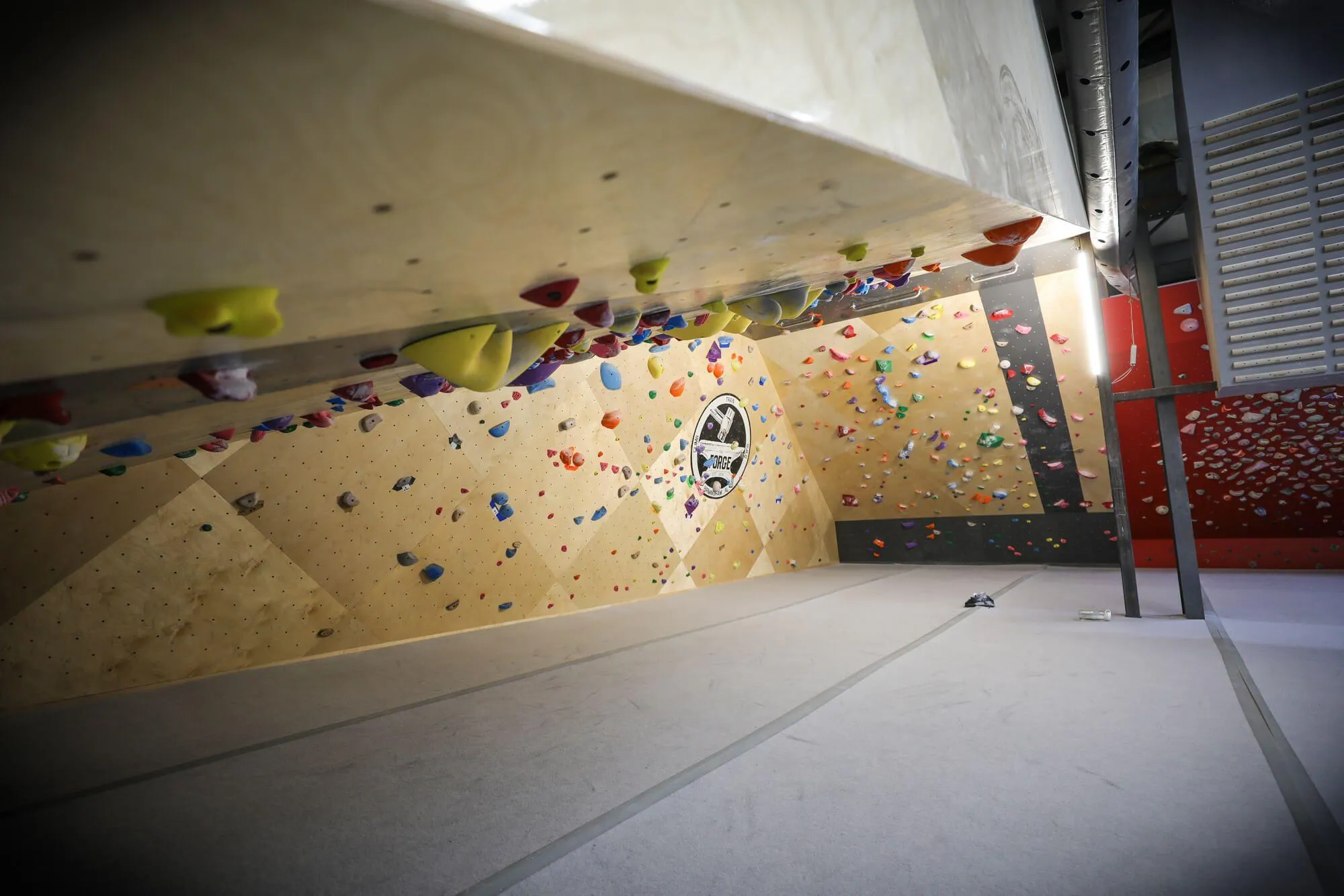 This is what a 70º climbing roof looks like. This angle makes the 55º opposite wall look tame by comparison. Both serve to make a serious and unique impression on climbers who think they are worthy.
