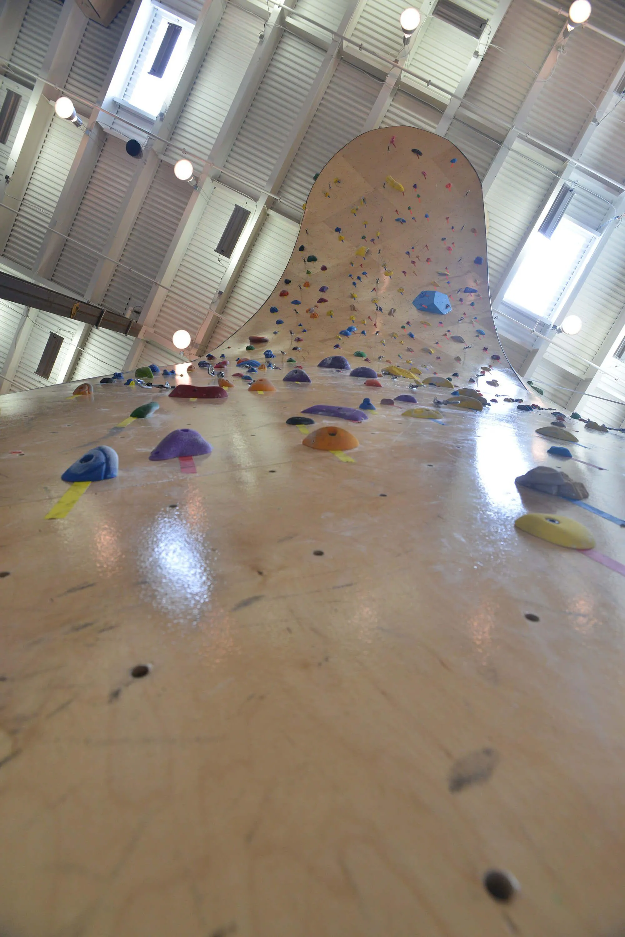 A ground view of how intimidating the “tongue” is at this facility. For lead climbing only, this distinct and wonderful feature requires committing moves. From this angle you can see where curved ARC walls from Vertical Solutions have a distinct advantage over our competitors geometric systems.
