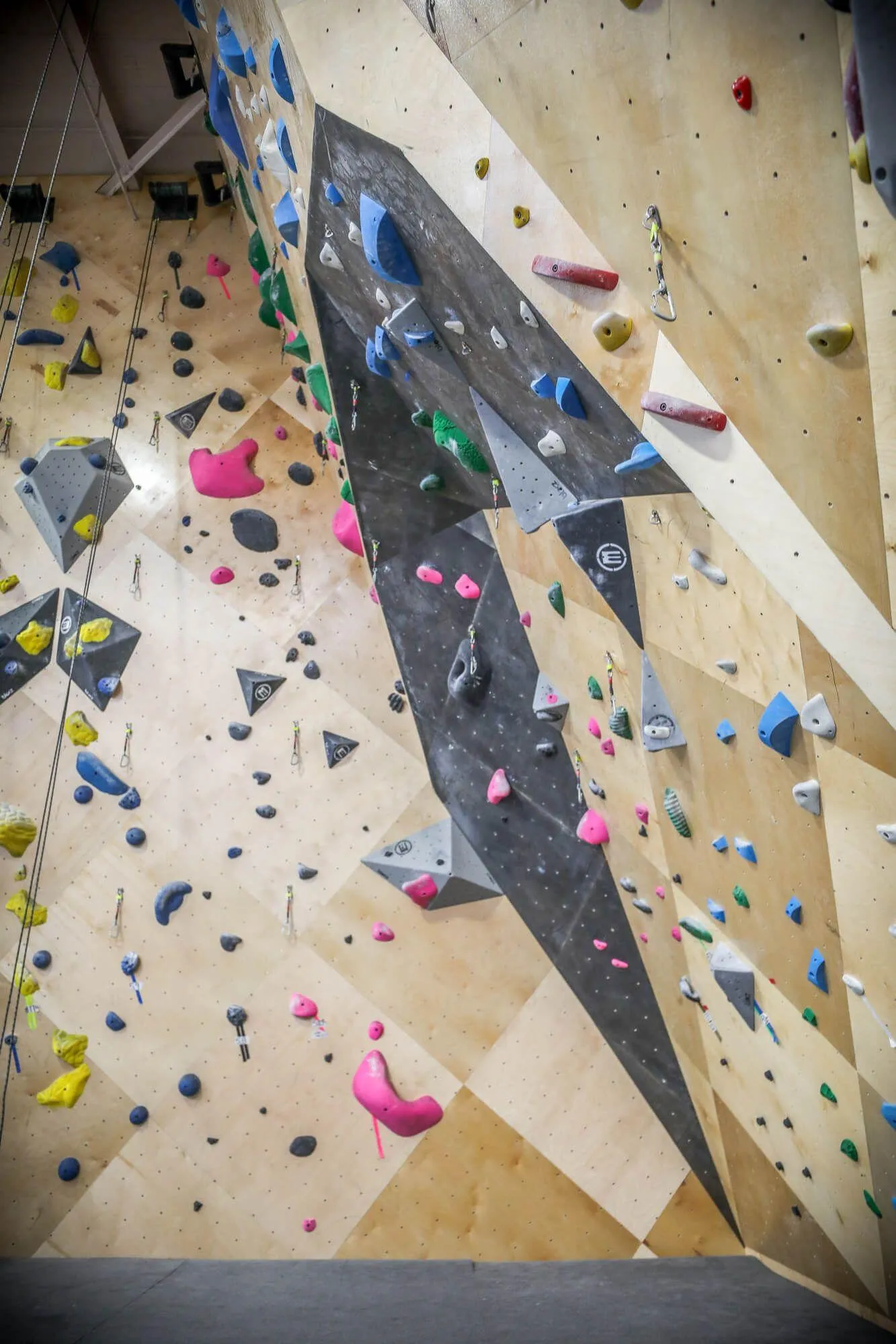 A more obvious view of the overhung angle built into the Vertical Solutions-designed rope-climbing area. Using custom stains and the MLM geometric panel manufacturing process, you can create interesting features that are also visually appealing.  
