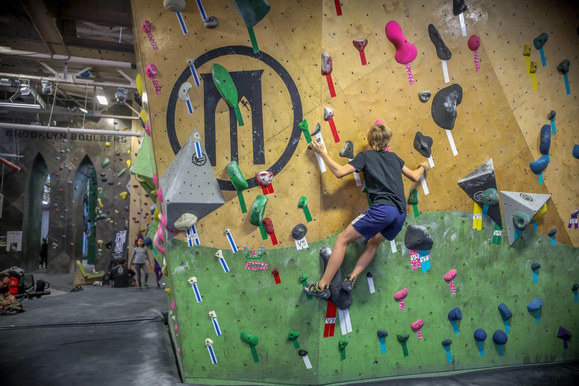 The first climbing wall you are greeted with upon entering, BKB made sure to have their branding heavily integrated on walls, volumes, and within design features. 
