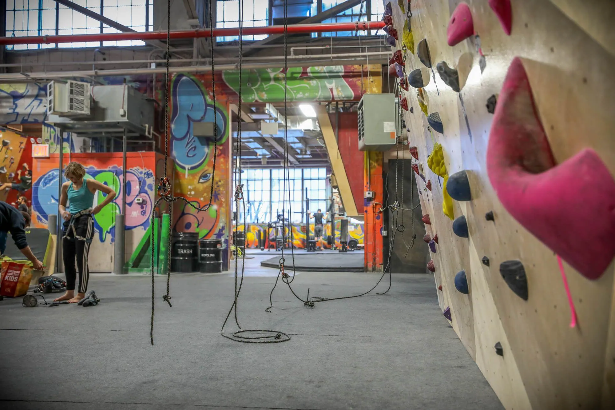 A view down one of the top-rope walls built by Vertical Solutions, into the strength-training rooms. Space is hard to come by in New York City, but BKB made sure that eery area was used efficiently while still allowing enough space to not feel totally cramped during peak hours. 
