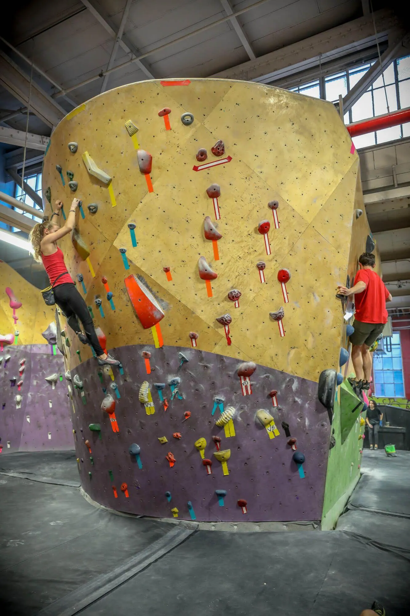 For this special bouldering area, the space was maximized to create a peninsula of walls combining both ARC (curved) and MLM (geometric) wall design/manufacturing styles. 

