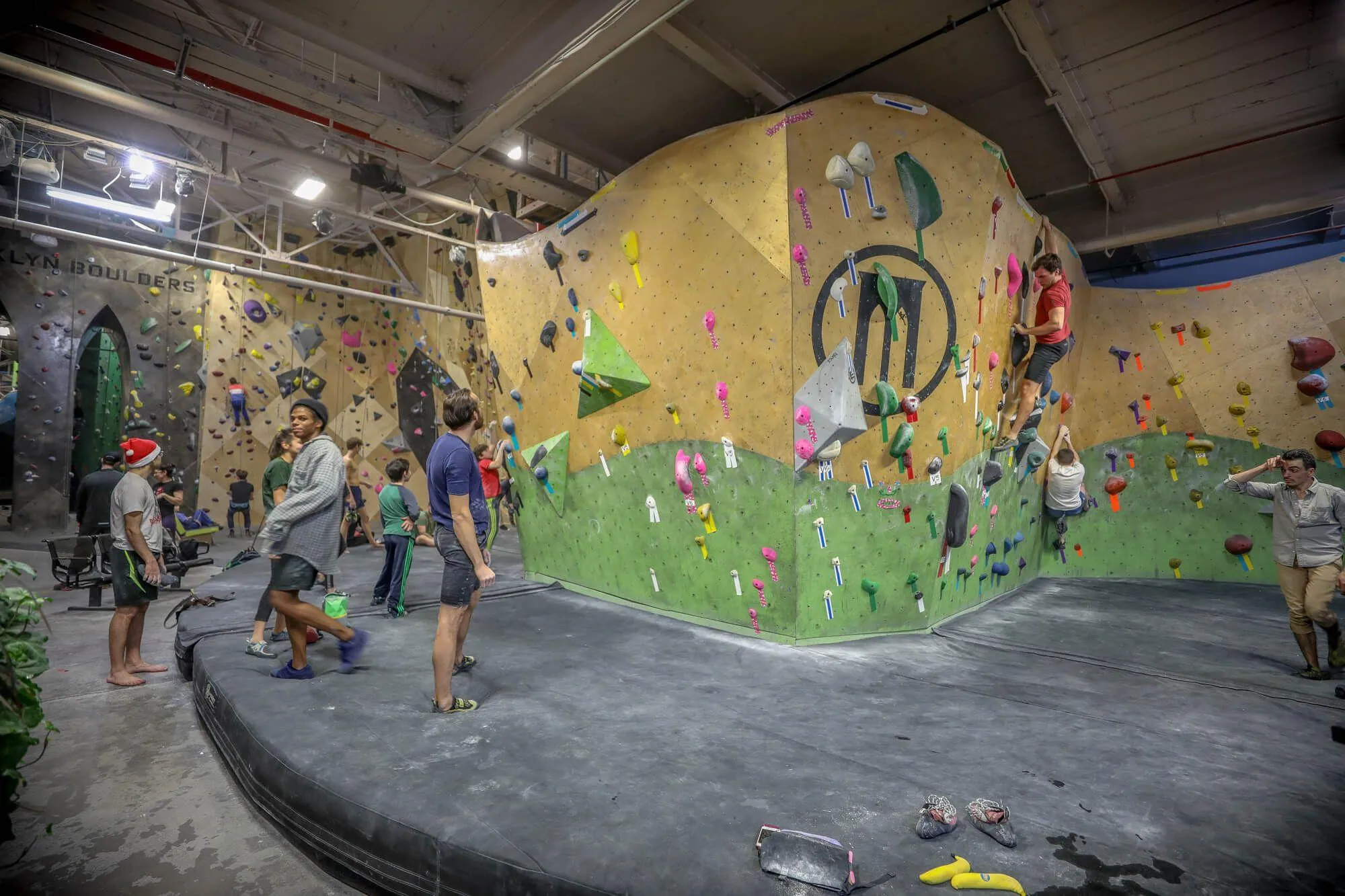 Another view of the entry bouldering peninsula built from both MLM and ARC climbing wall styles, and the Habit Flooring system that protects climbers from injuries. 
