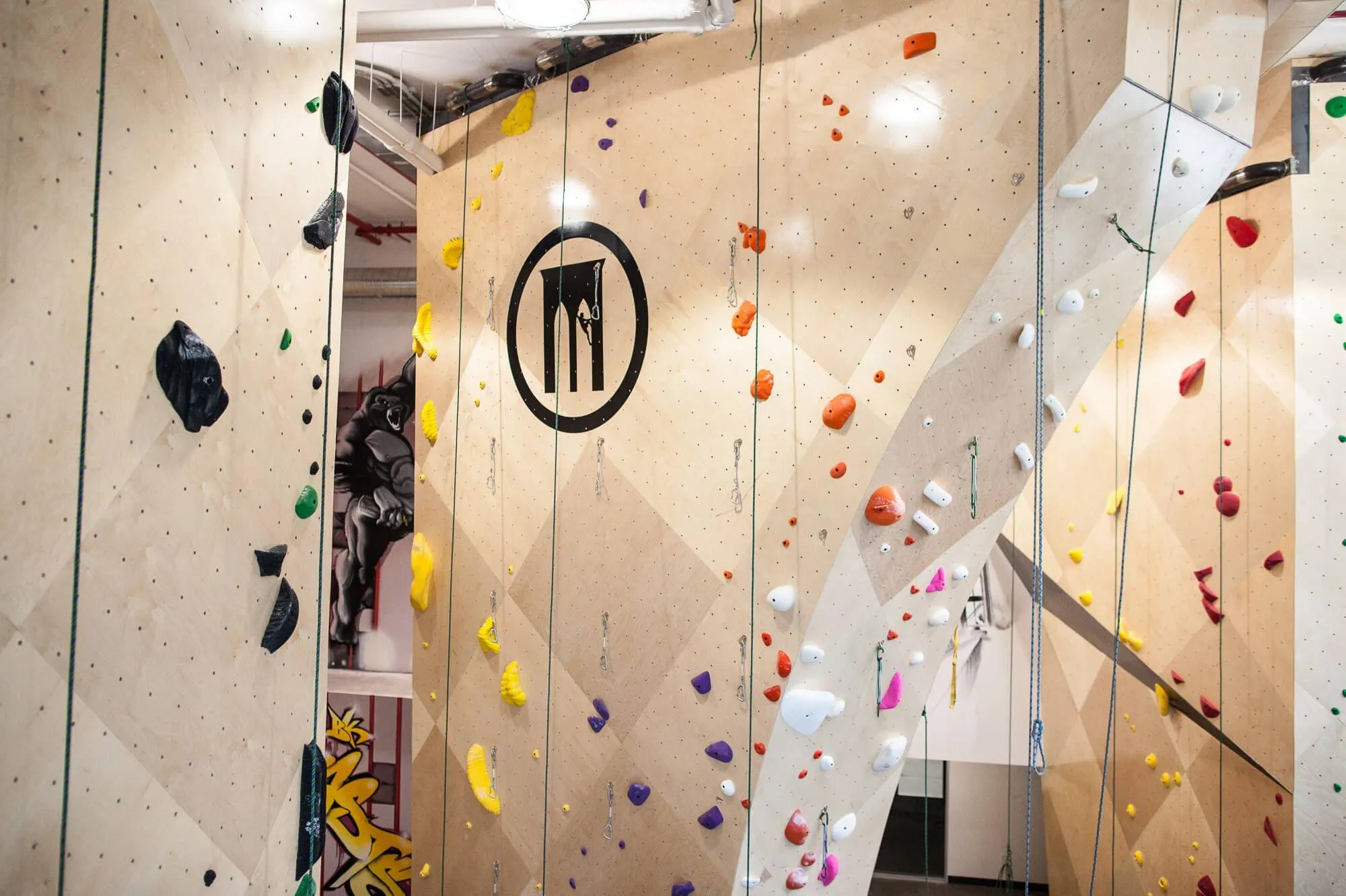 Being beneath a NYC high-rise building didn’t stop BKB and Vertical Solutions from designing and building rope-climbing ARC walls with substantial height.
