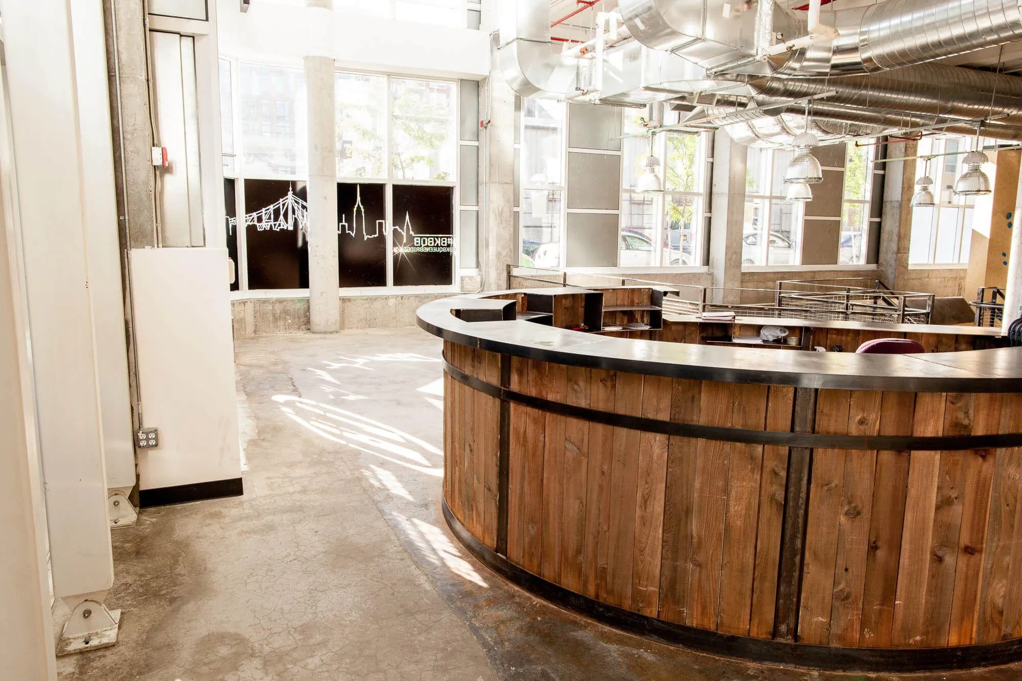 The entrance to this location is pretty special. You don’t come into this space expecting to see all of the climbing area that they have, or the plethora of art on the walls, let alone all of the intricate details like this custom front desk we built for them.
