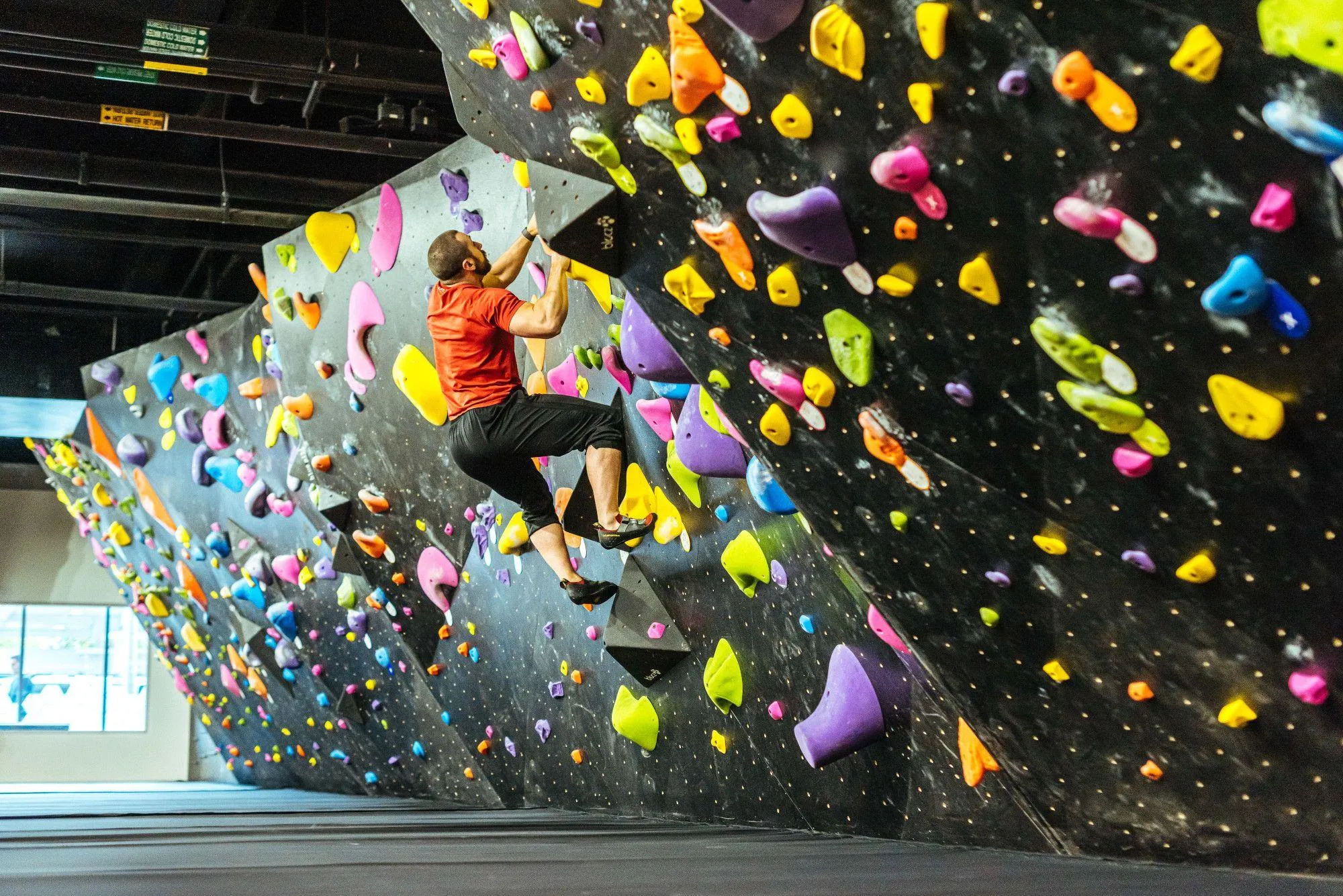 BKBX chose to use ARC walls for their bouldering area, incorporating the same custom paint and texture finish used throughout the facility.