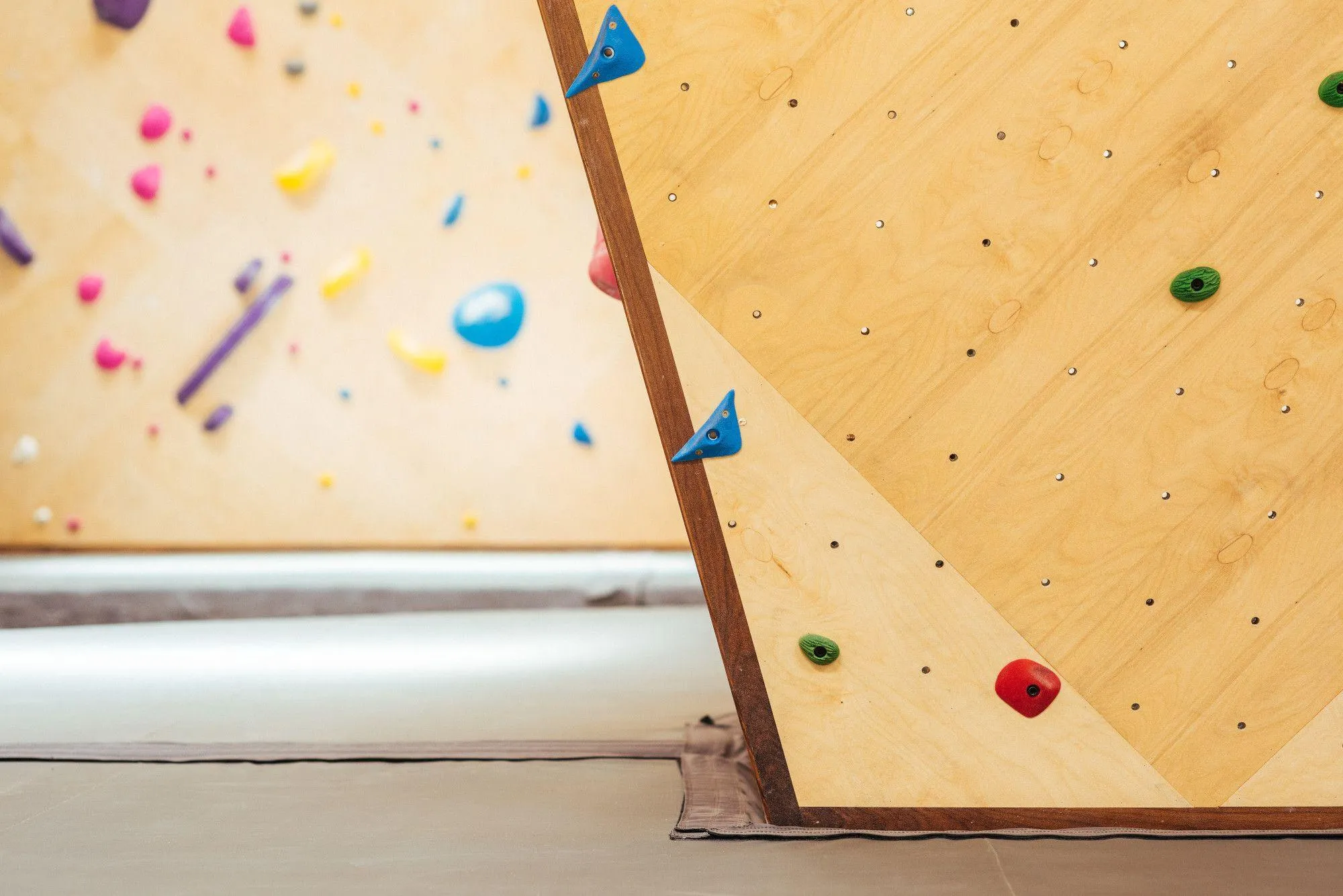 Habit's Wall Attachment system helps keep pads flush with the bottom of walls providing a consistent fall zone.