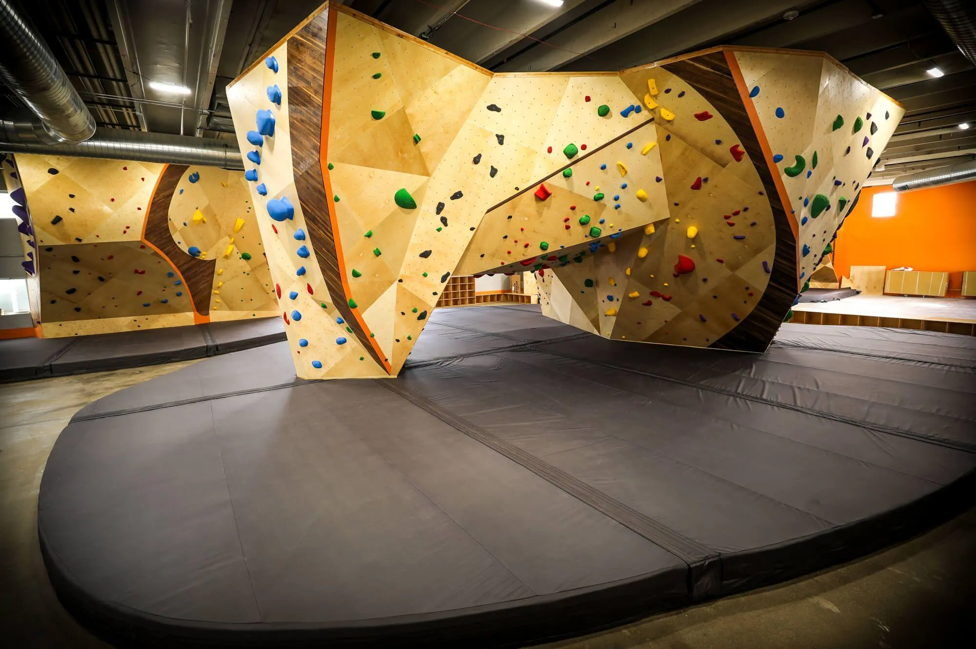 The Habit Flooring installed throughout the facility has more than enough coverage around this super versatile freestanding boulder in the center of the floor-plan.
