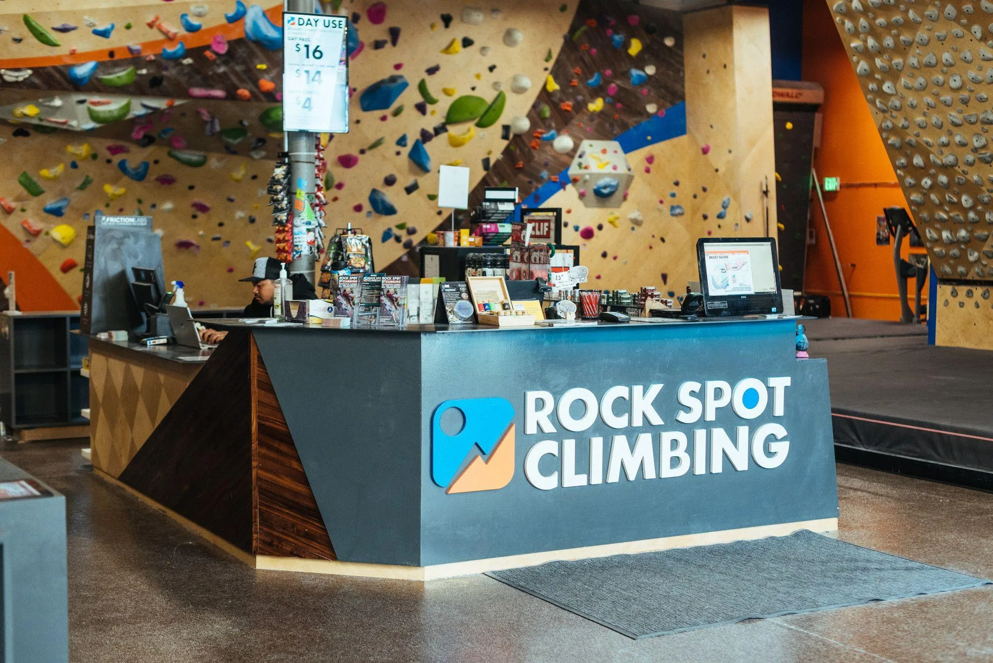 The front desk was custom designed and built by Vertical Solutions to match the aesthetic of the bouldering walls.