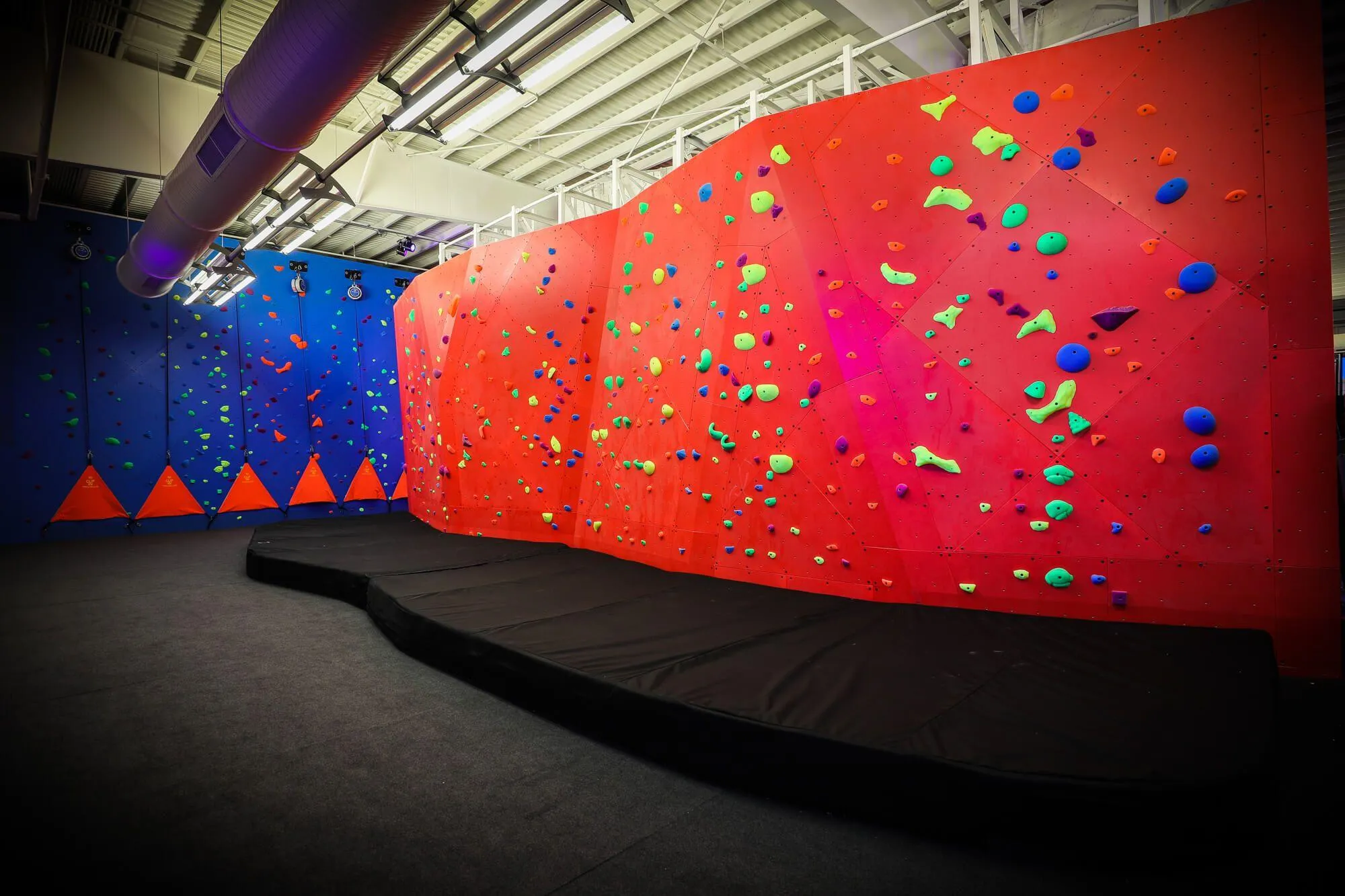 In the daytime, these SLM-built walls look just as good as under the blacklight. The deep and rich colors we applied were chosen by our clients to both keep it simple and fun, and react in different ways to the blacklight installed throughout the facility.