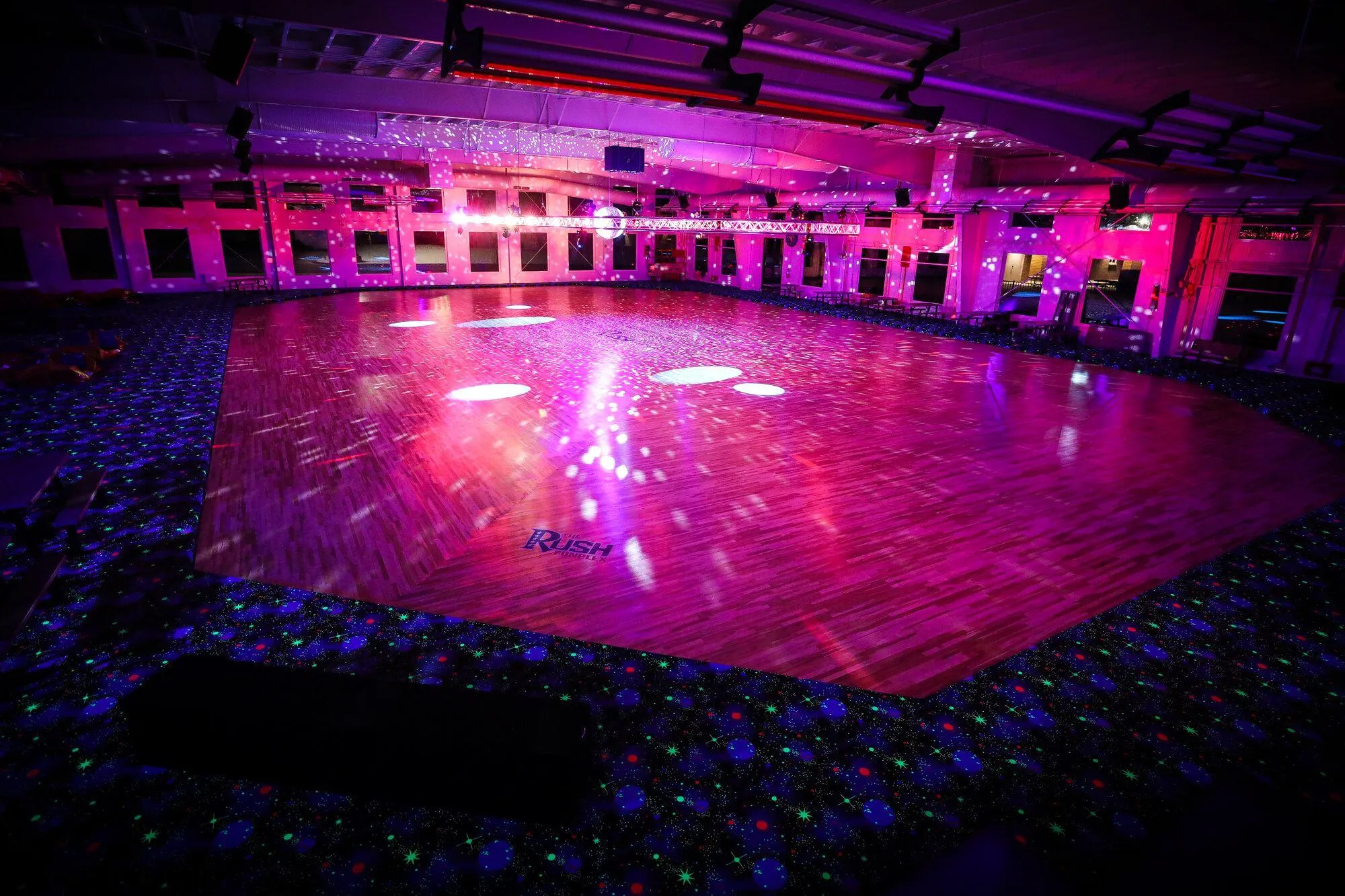 Directly adjacent to the climbing walls is this beautiful large-format roller rink with disco lighting in the center. Combined with specialty carpet and climbing walls for blacklights, this facility is a kid's dream playground.