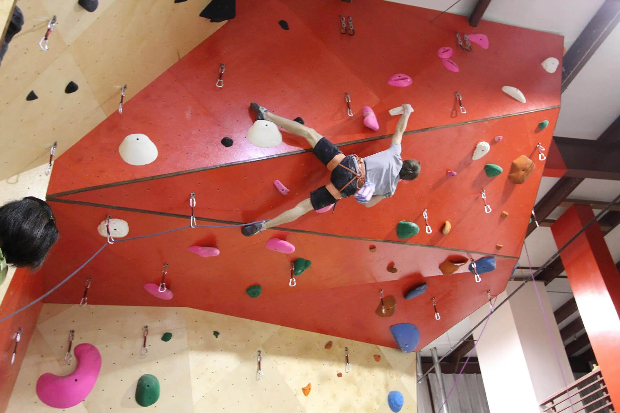 This image gives perspective on how challenging this massively overhung lead climbing wall was built to be.
