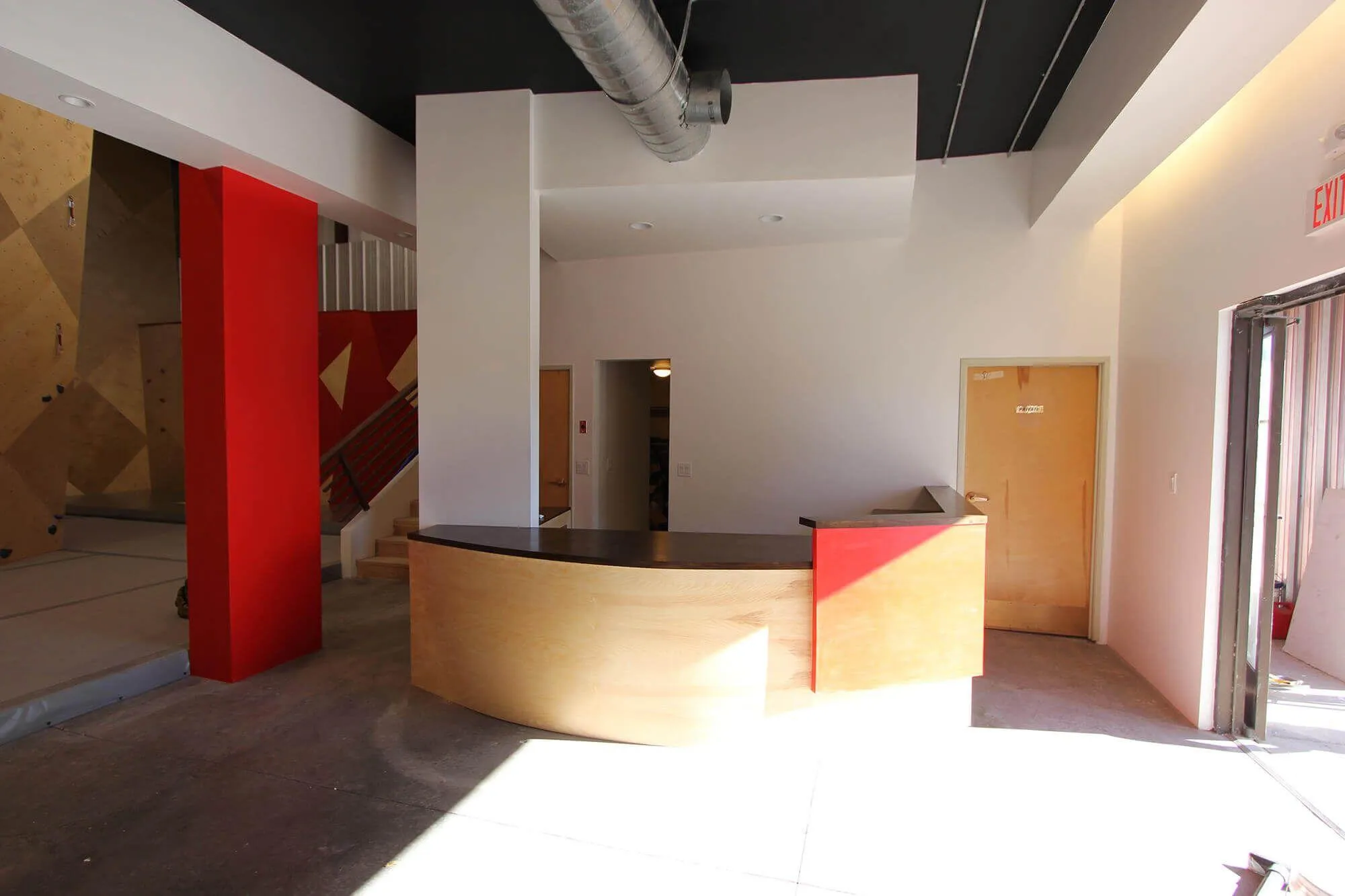 Although unfinished in this picture, the front desk area turned out looking great and stayed on-brand with the rest of the facility as intended.
