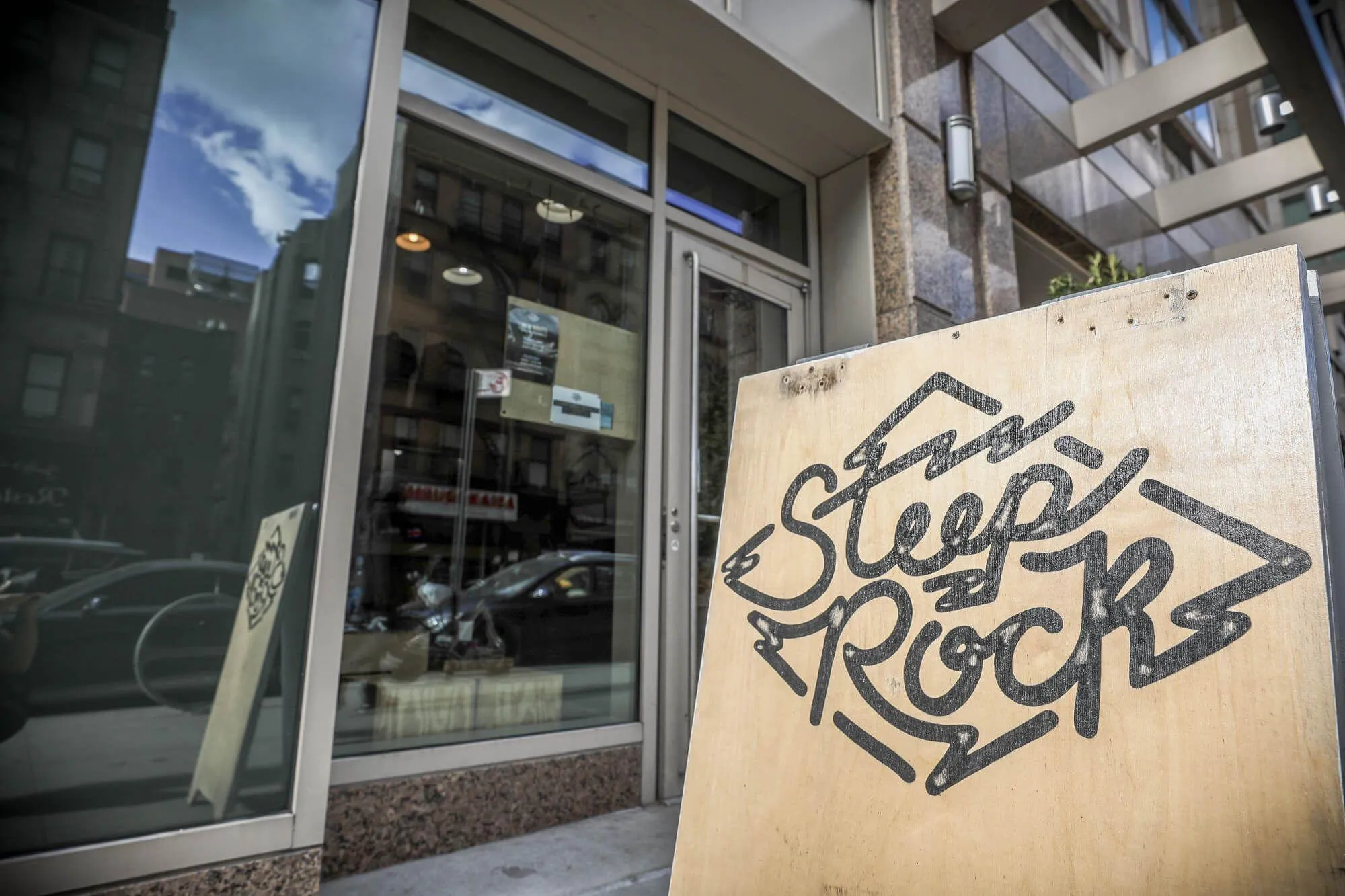 Outside, even the sandwich-board is on-brand and constructed of wood.
