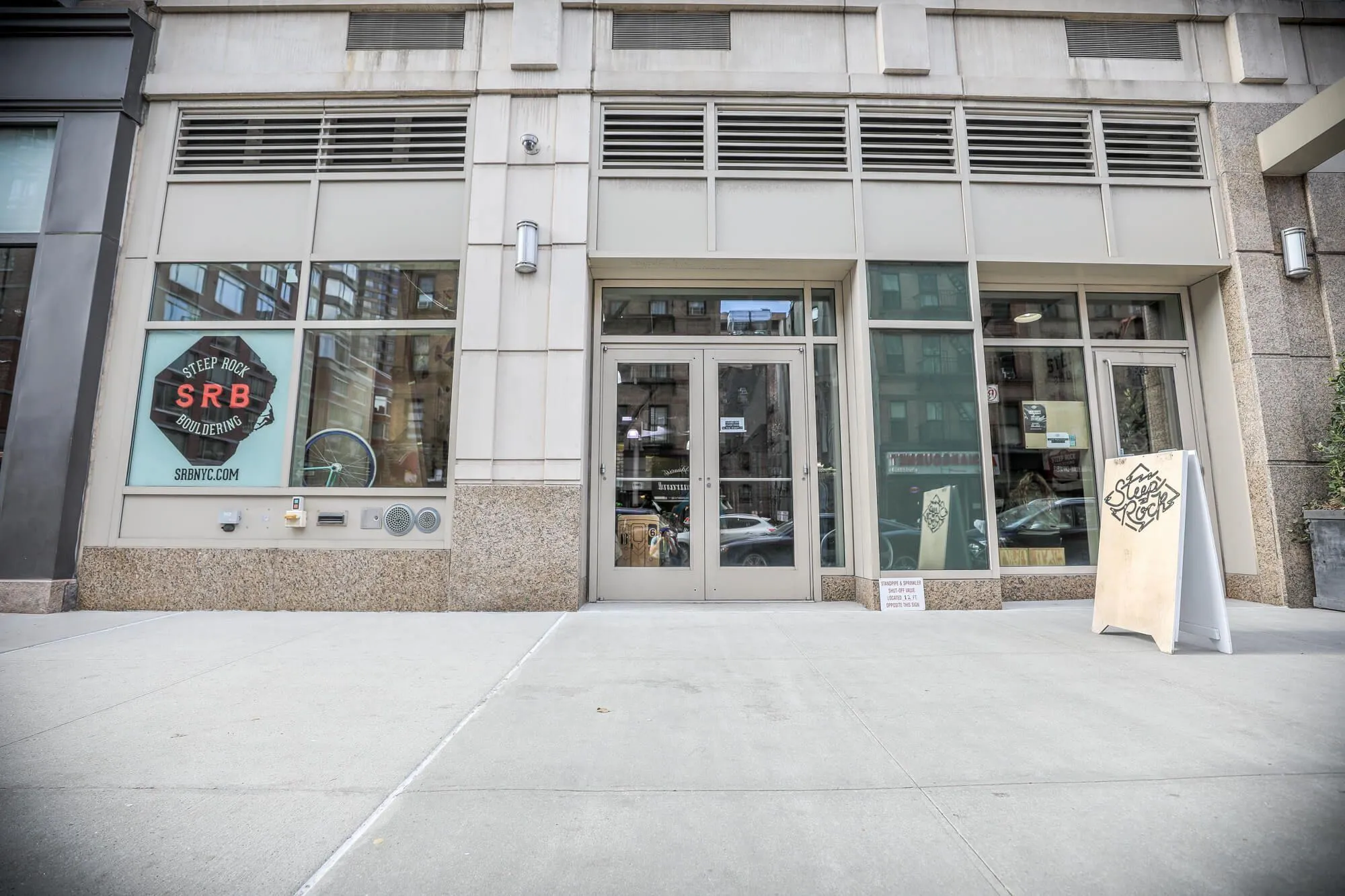 A street view of the entrance, showing full width of the facility and giving people an idea of whats in-store for them inside, despite the metropolitan facade.
