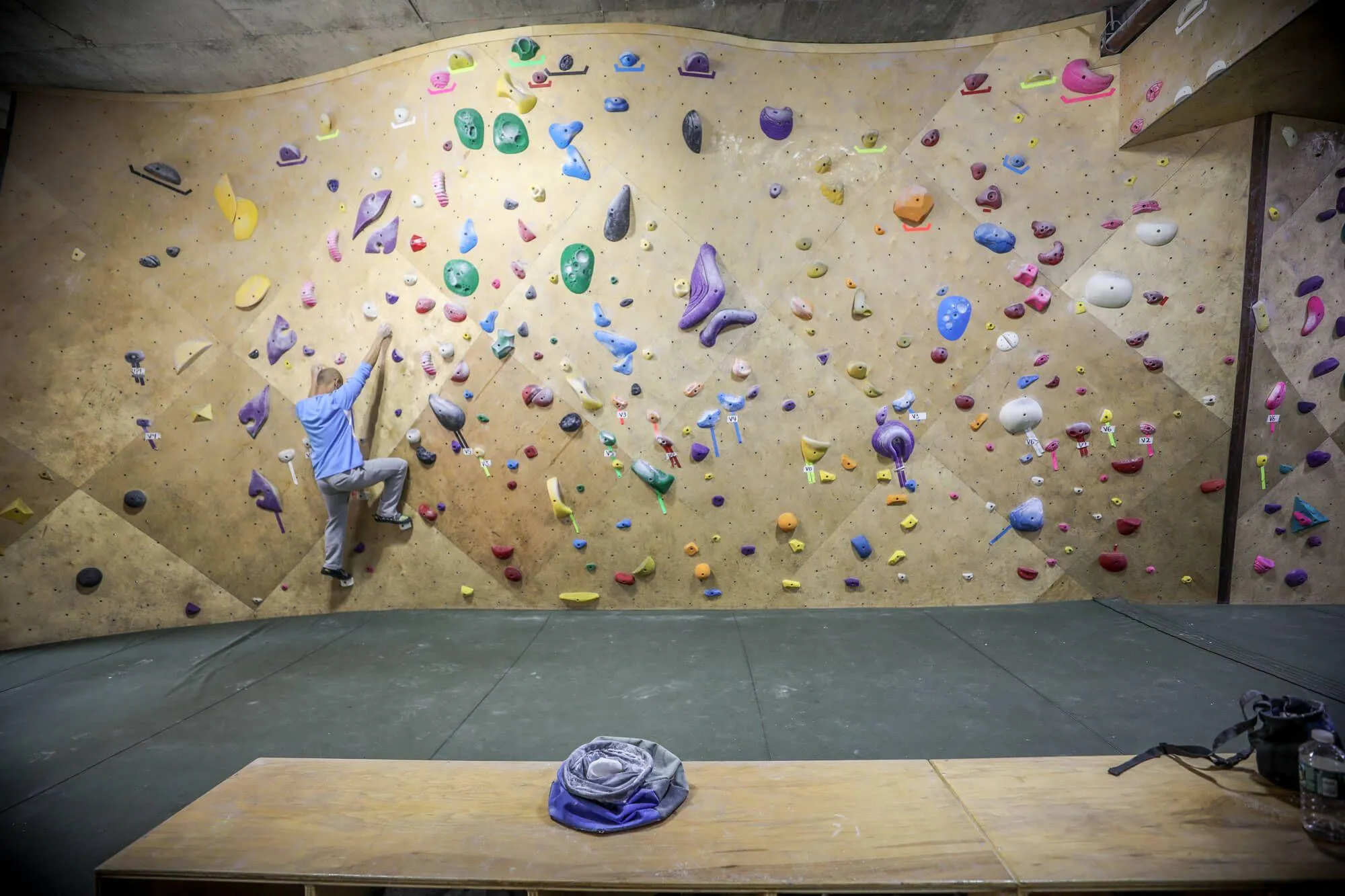 This wider angle shows how much more interesting you can make a climbing wall with ARC designs from Vertical Solutions. You can see the base of the wall closely following the floor-plan, while the top is varied a ton to create interesting and complex routes for climbers of all levels.
