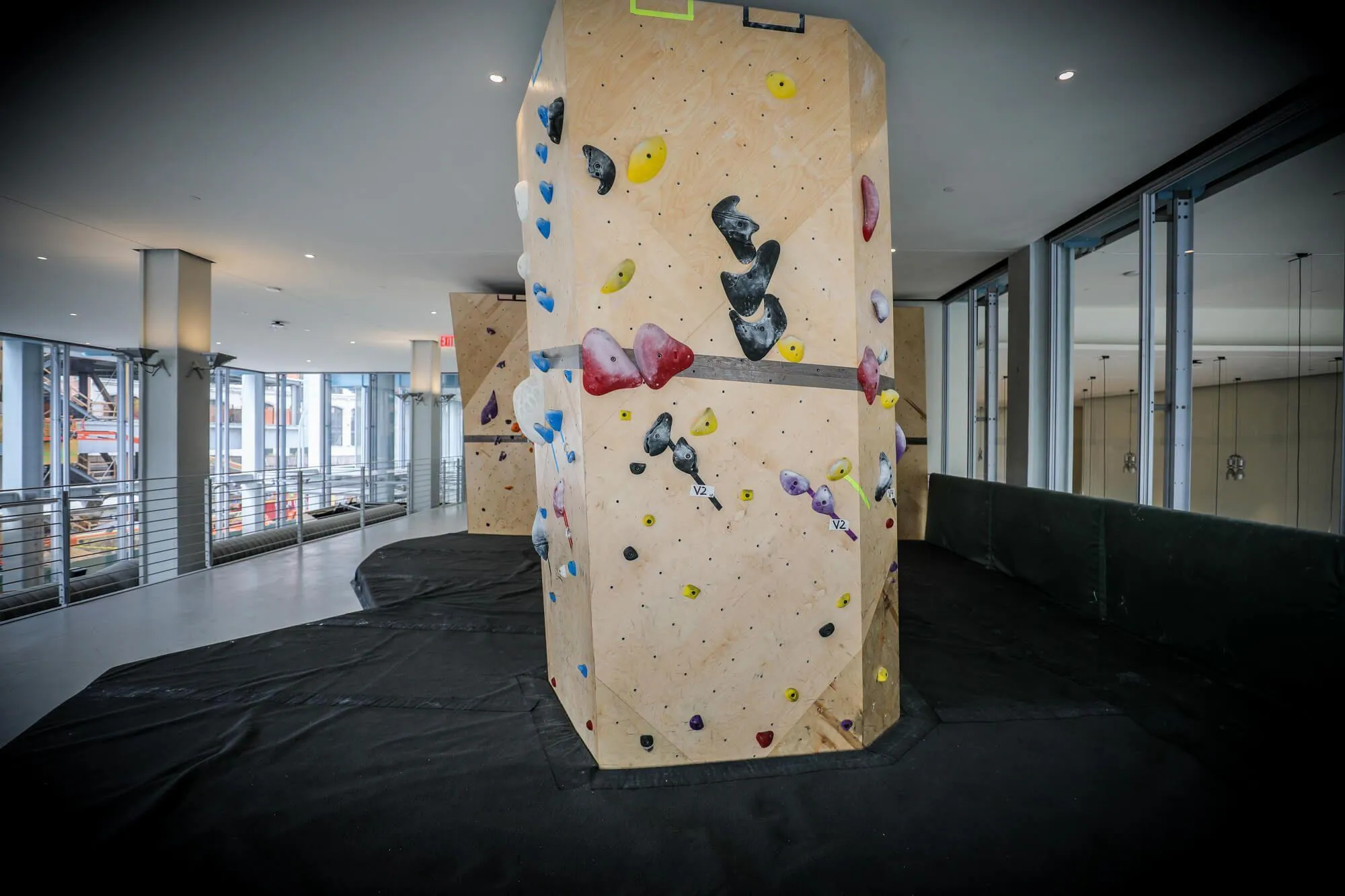 The end cap of the bouldering walls upstairs on the mezzanine. While the height of this section is limited to one-story, Steep Rock Bouldering is already known for its creative walls using single-story height throughout the entirety of its original location on the Upper East Side.

