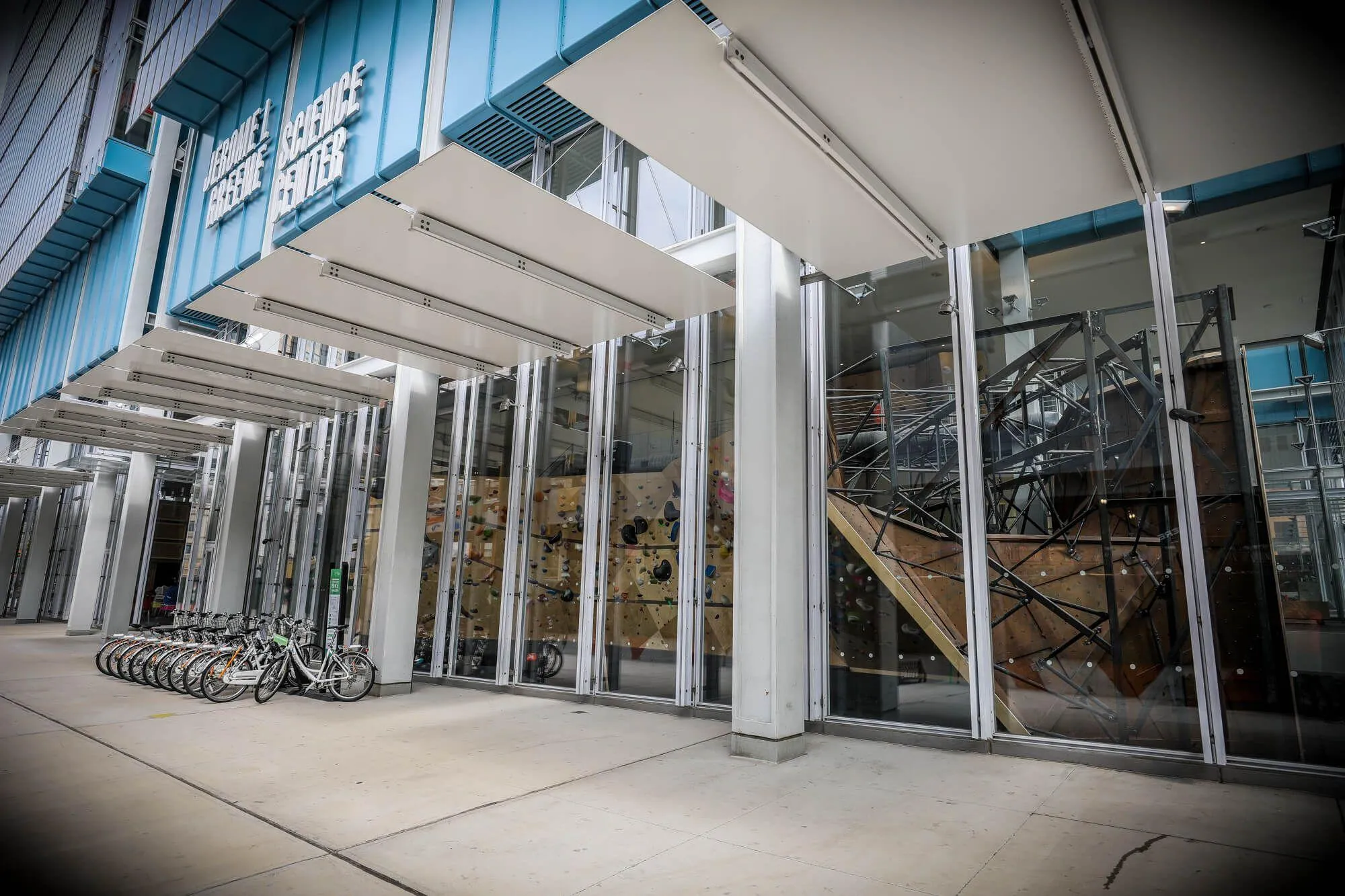 The south side exterior wall of the nine-story Columbia University building, which has a phenomenal view of the ground-floor climbing within. The climbing wall design was purposely positioned to be looked at both from climbers inside and passers-by outside.
