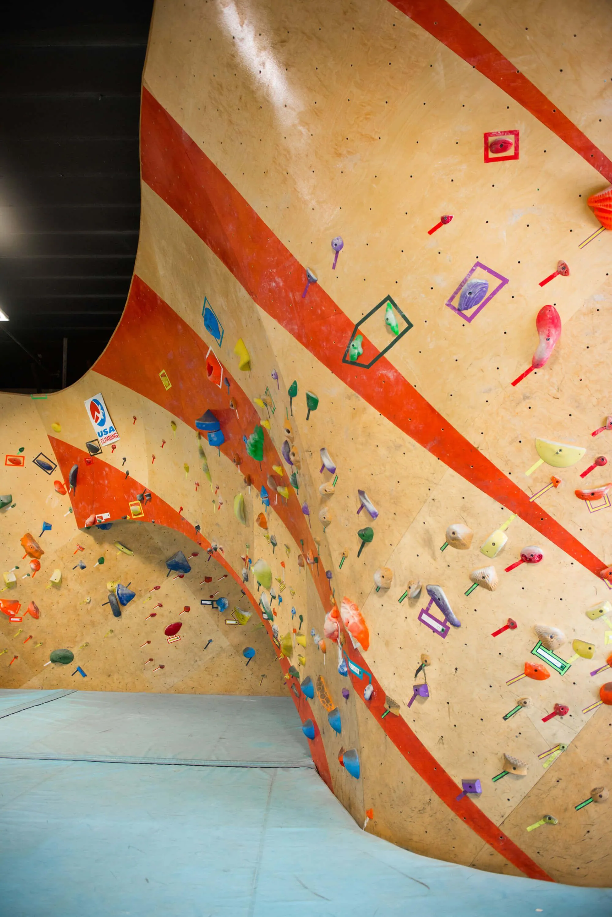 Seen here is part of the bouldering wall design the indoor climbing gym which blends an island and main bouldering wall to create a vast bouldering cave for their climbers.

