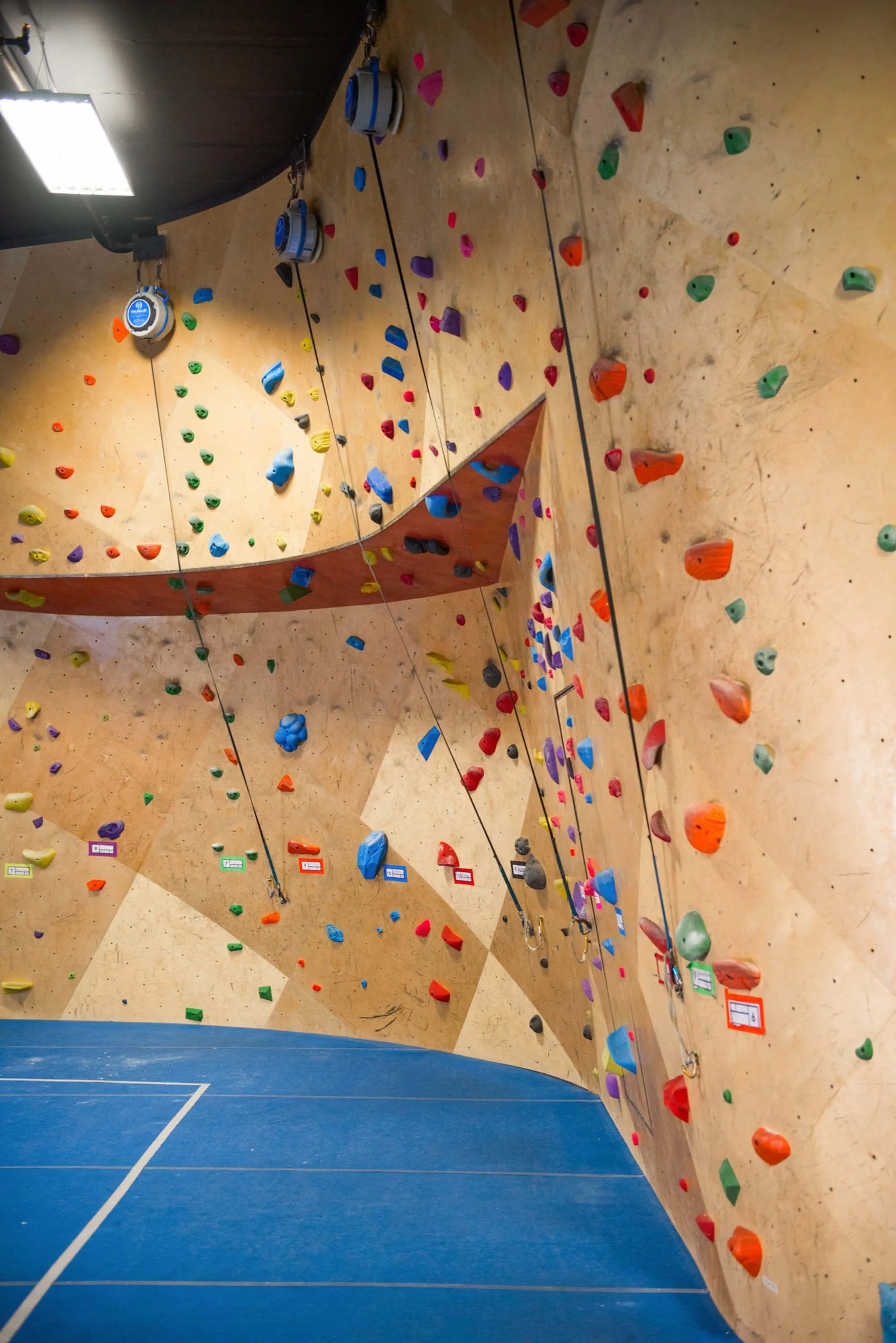 Not pictured in most other images, was the beginners indoor rope climbing area just to the left of the main bouldering climbing walls. Auto-belays are set up to introduce newcomers to climbing with ropes, and if interested further, they have the opportunity to visit the sister facility down the road that is a fully purpose-built indoor rope-climbing gym.
