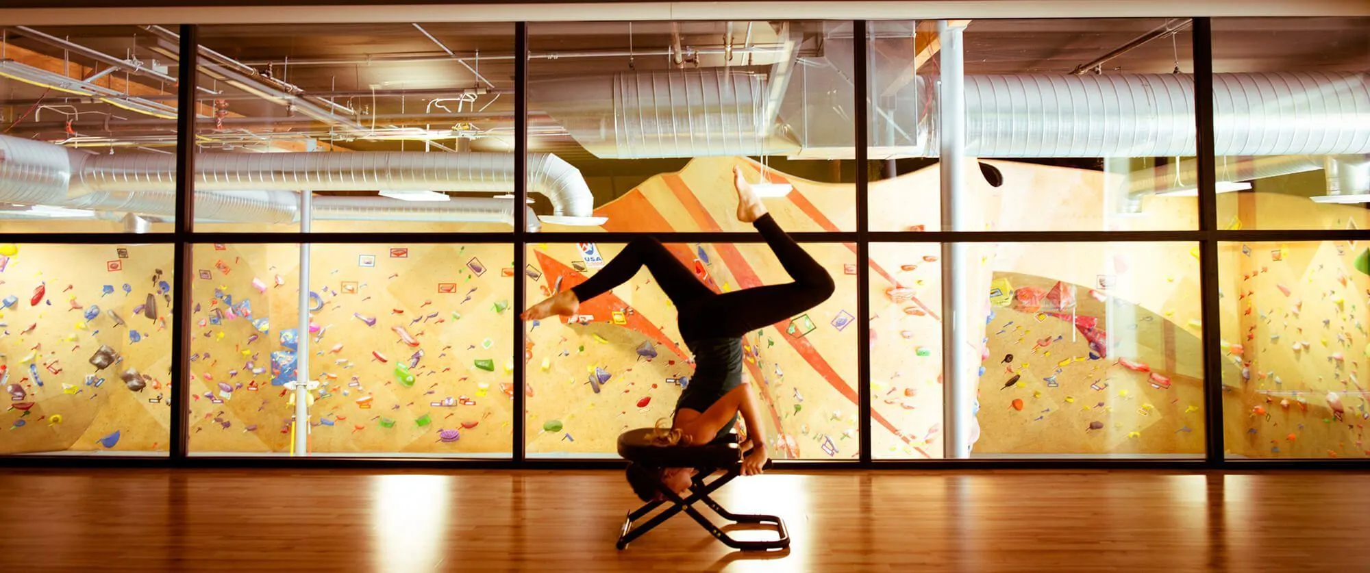 While in the yoga studio and fitness areas, you can overlook all of the indoor climbing taking place below you on the ground floor. This helps instill that feeling of community throughout the facility.
