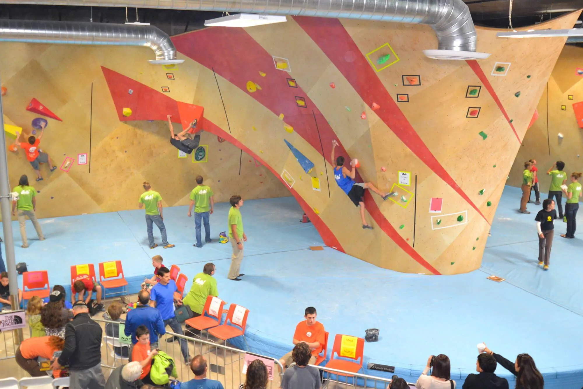 The indoor climbing walls were designed and built by Vertical Solutions, and features this really unique climbing boulder island that morphs into a steep cave around back. The owners wanted to go with a custom graphics scheme that used our abilities to produce the perfect color stain and paint to accentuate the climbing wall features.

