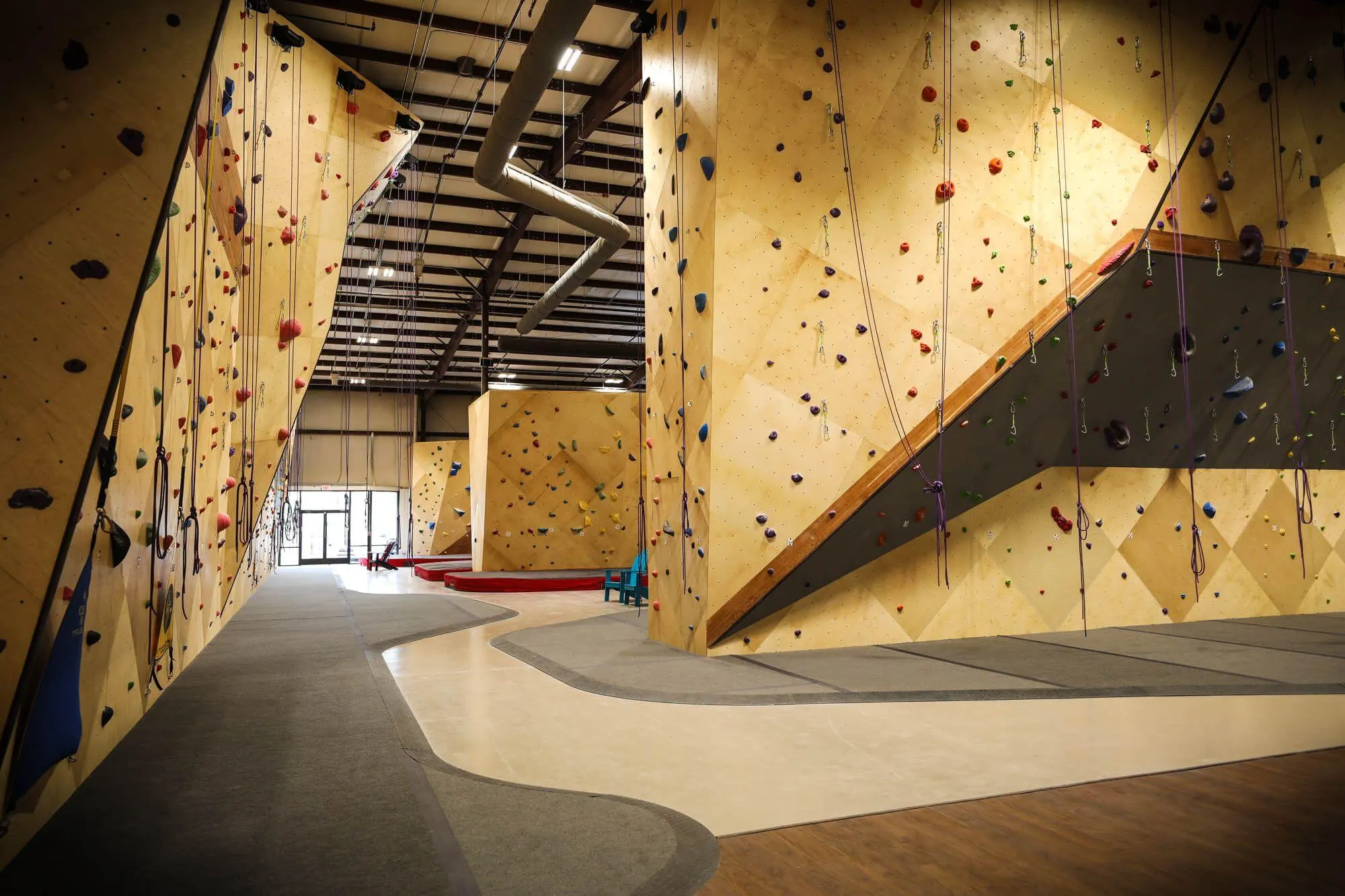 You can get a good idea of exactly how spacious this climbing gym is by looking at the separate areas lined up next to each other; route climbing areas on the left and directly closest to the camera, and then two bouldering areas beyond that.
