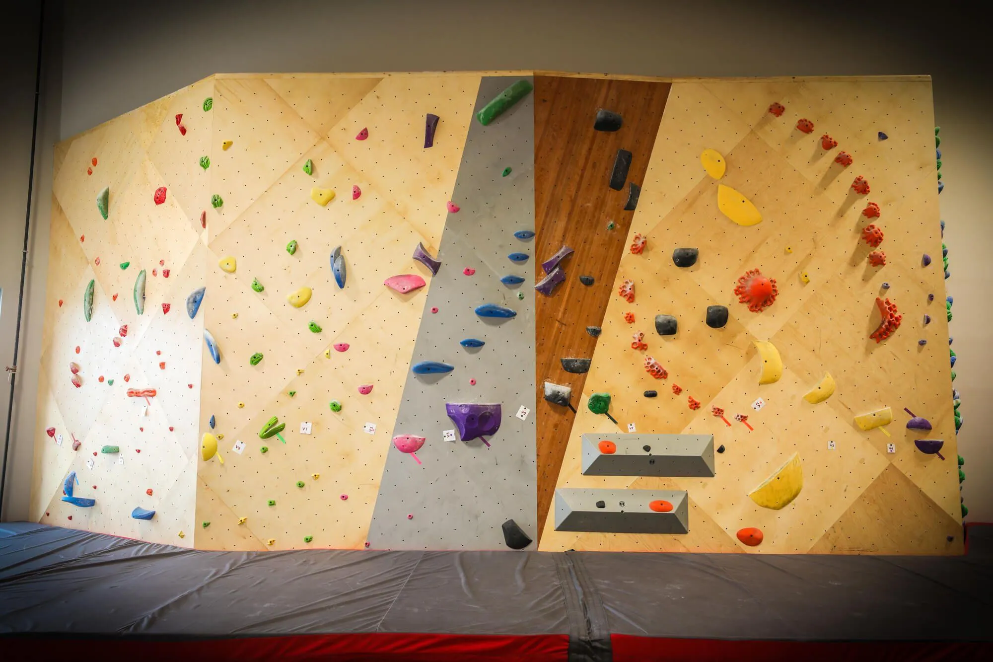 Bouldering at The Crag is actually split up into three unique areas. The first one seen here, is just off to the left of the main entrance and features the most upright problems in the entire climbing gym. This doesn't stop their routesetters from using this as a canvas for challenging problems taking advantage of the wall's lack of natural overhung design.
