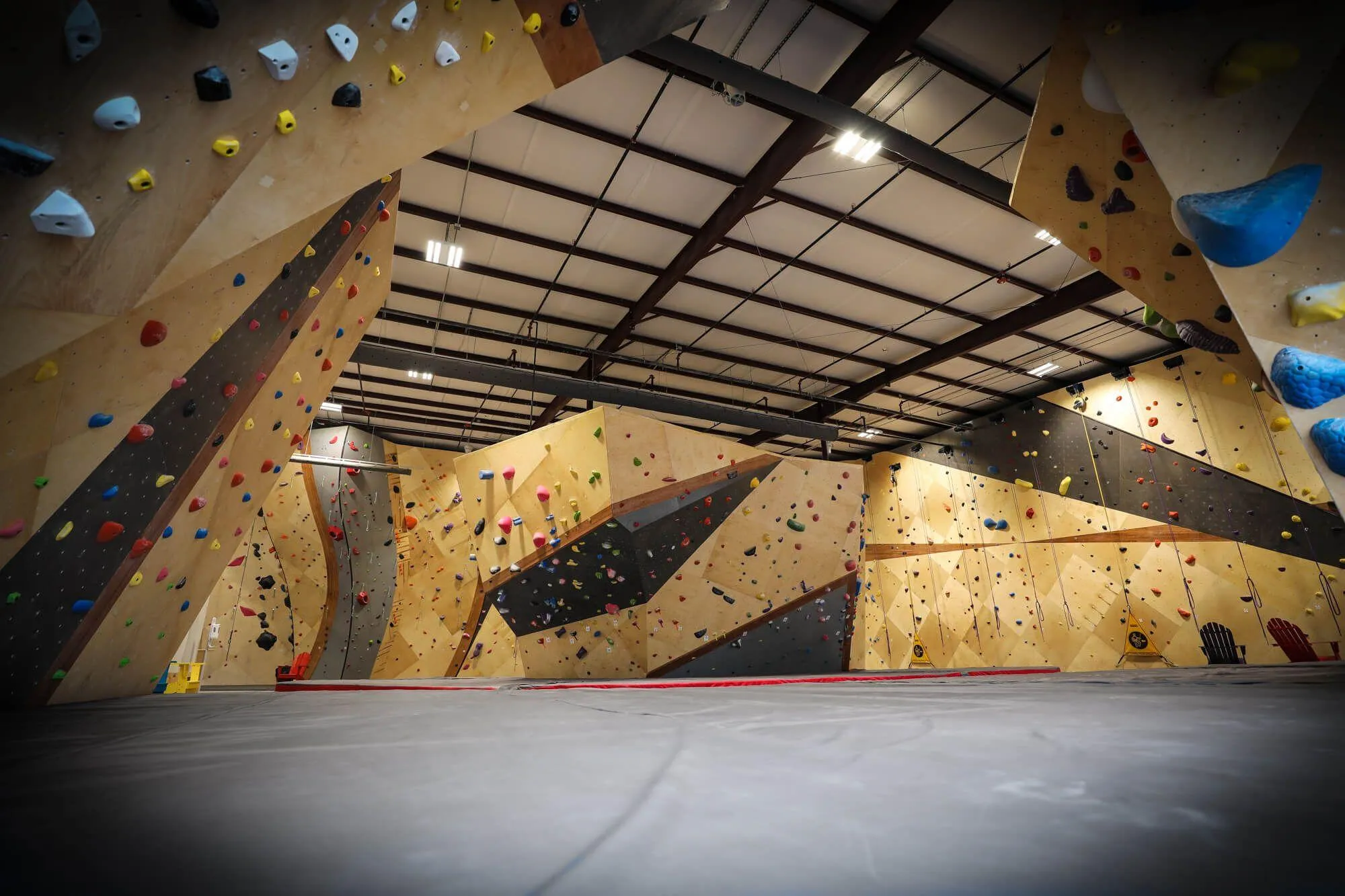 Super-wide angle view underneath the Moon Board showing how vast this facility is and ultimately how a hundred climbers would still have trouble bumping into each other. This indoor climbing gym certainly has something for every climber, and then some.