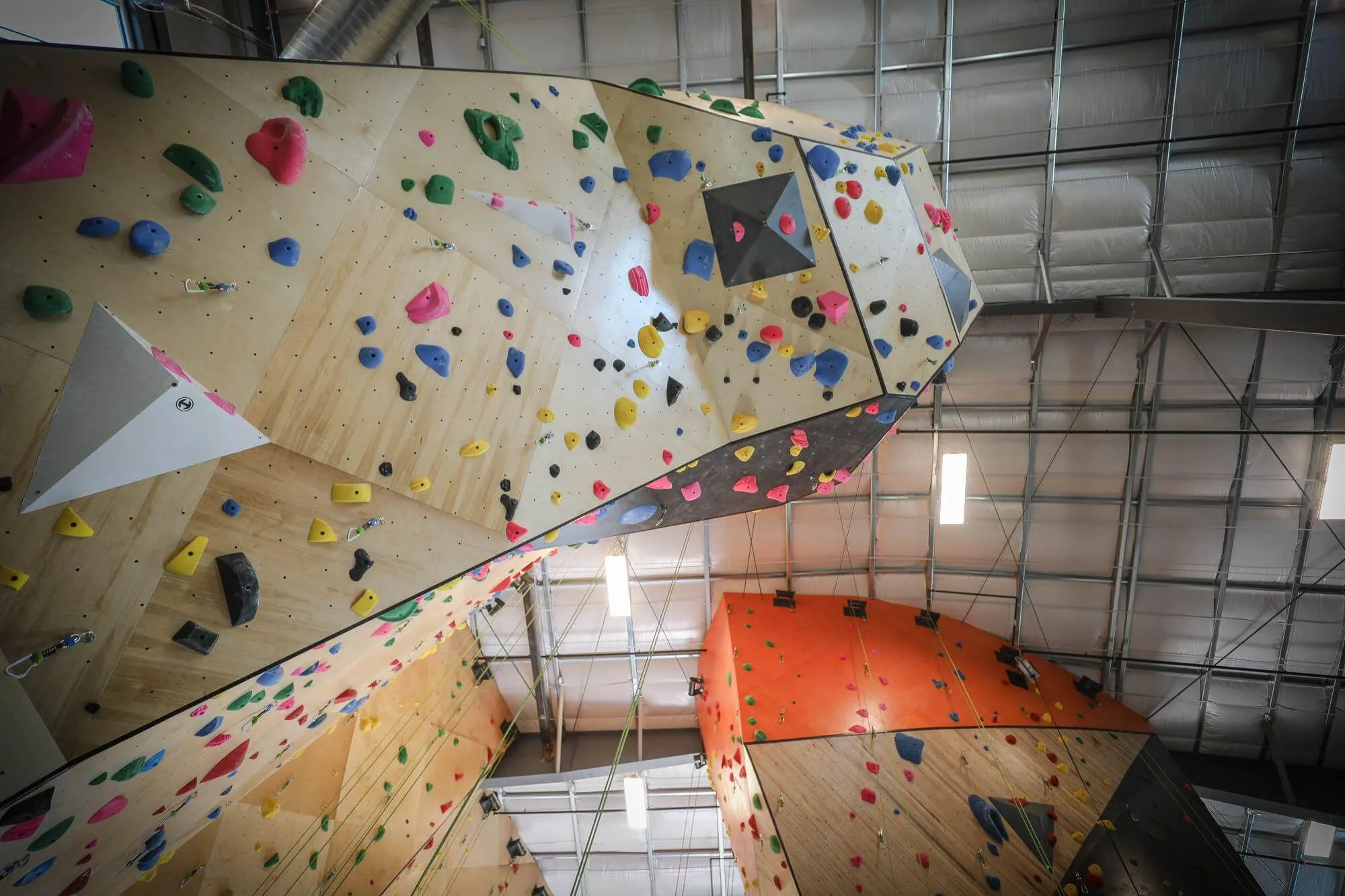 An uphill look at one of the huge overhung MLM climbing wall structures that is a favorite among the members and features the longest routes in the gym.
