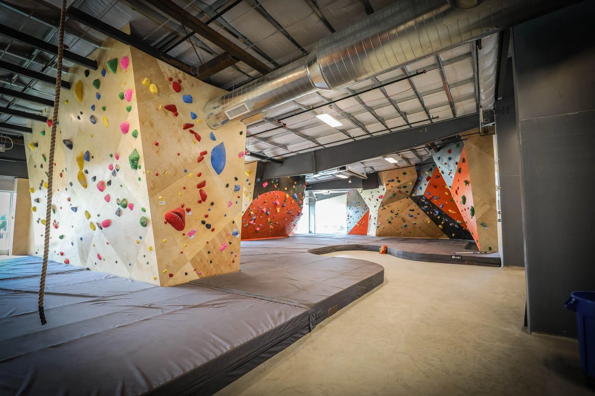 The first look you get at the bouldering specific area at the top of the second level. Every foot was meticulously thought out for user-flow and eliminating any cramped feeling even during peak times.
