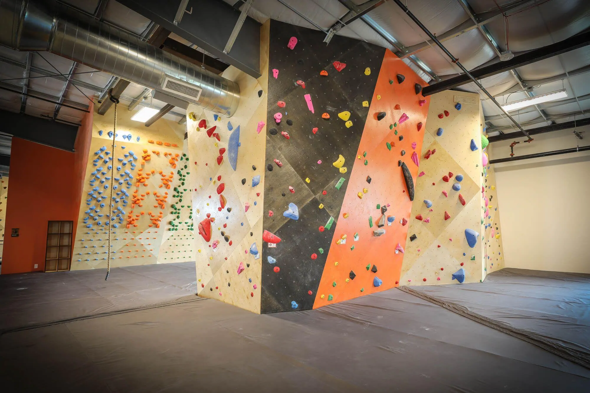 Just a minor section of the bouldering area upstairs complete with training-specific systems boards in the background and MLM design/construction throughout from Vertical Solutions.
