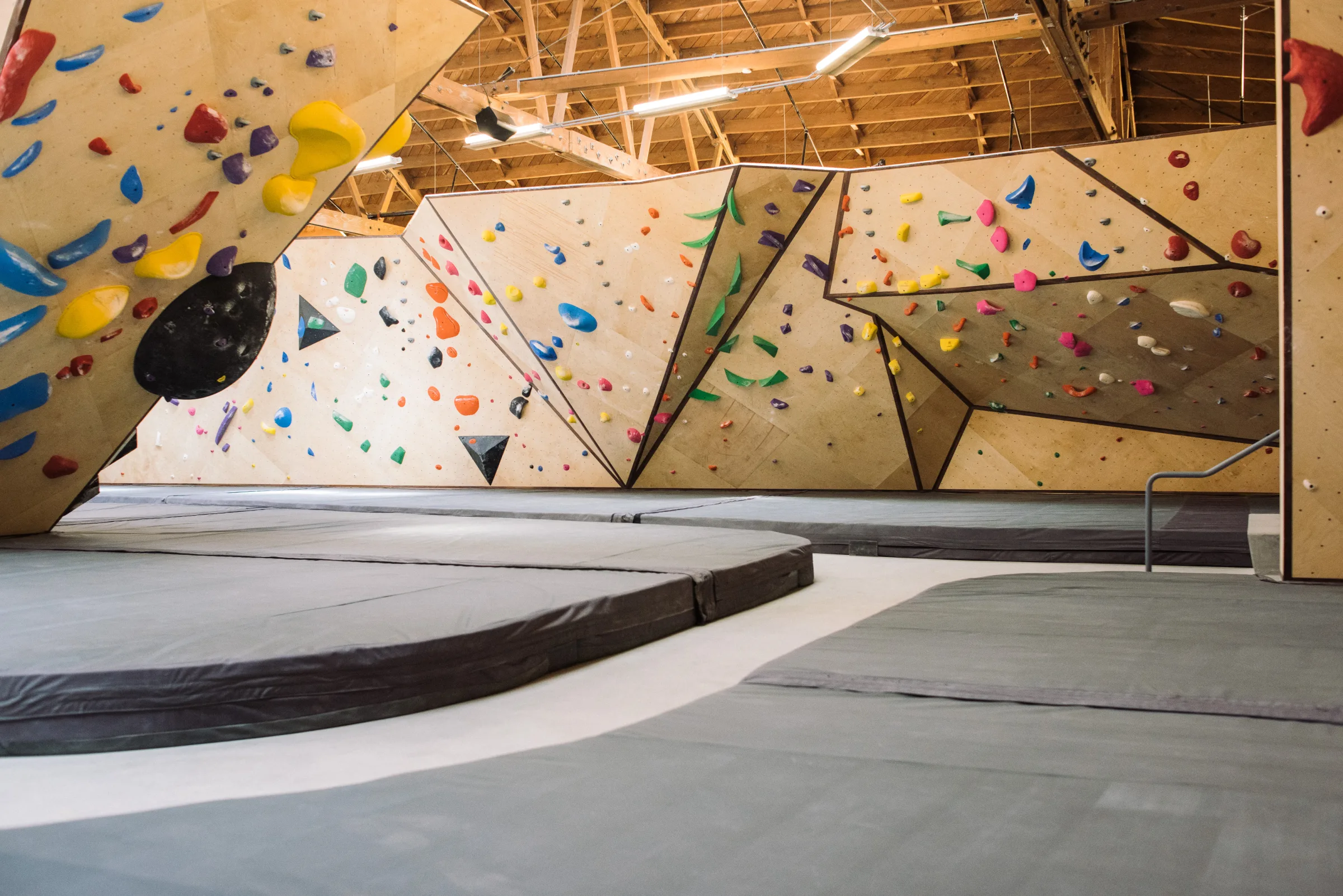 Custom climbing gym flooring installation by Vertical Solutions
